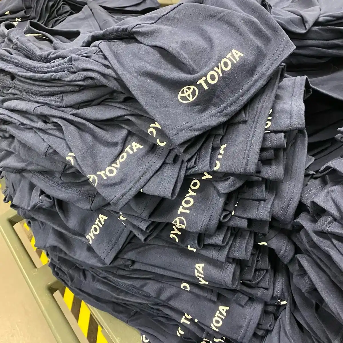 Bulk workwear t-shirt order with company logos — workwear printing Richmond